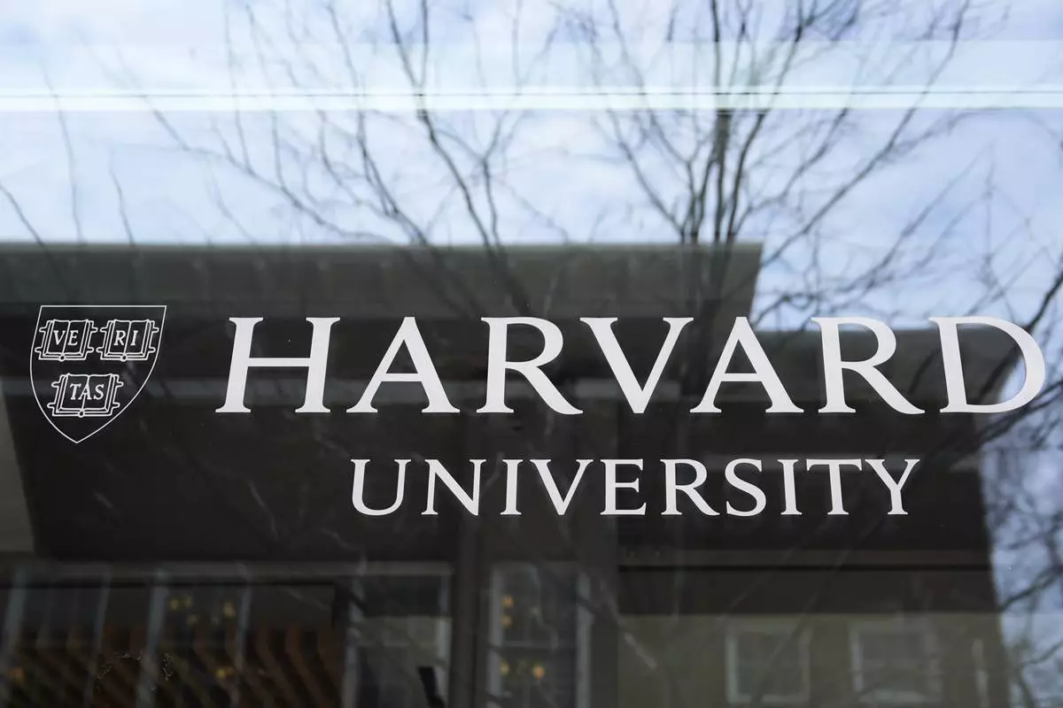 The Harvard University logo is displayed on a building at the school, Tuesday, April 15, 2025, in Cambridge, Mass. (AP Photo/Charles Krupa)