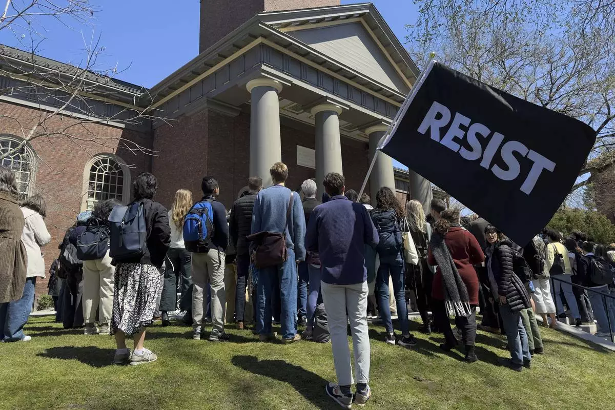 Students, faculty and members of the Harvard University community rally, Thursday, April 17, 2025, in Cambridge, Mass. (AP Photo)