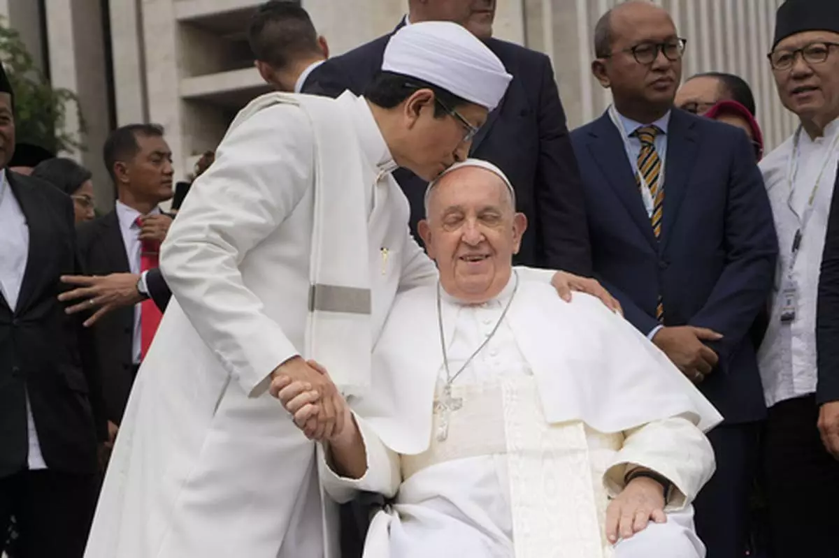 FILE - The Grand Imam Nasaruddin Umar, left, bids farewell to Pope Francis, as he leaves after signing the "Joint Declaration of Istiqlal 2024" at the Istiqlal Mosque in Jakarta, Thursday, Sept. 5, 2024. (AP Photo/Gregorio Borgia, File)