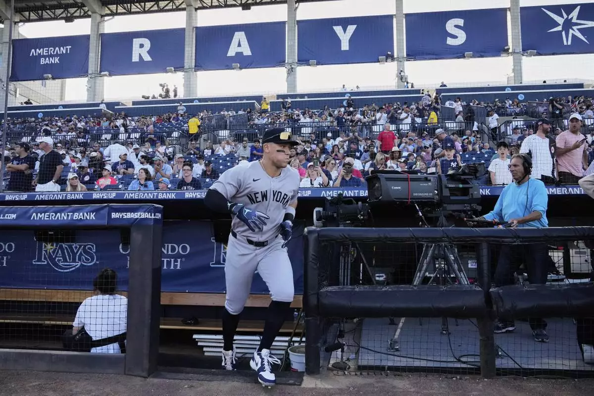 New York Yankees' Aaron Judge runs onto the field before a baseball game against the Tampa Bay Rays at George M. Steinbrenner Field Thursday, April 17, 2025, in Tampa, Fla. (AP Photo/Chris O'Meara)