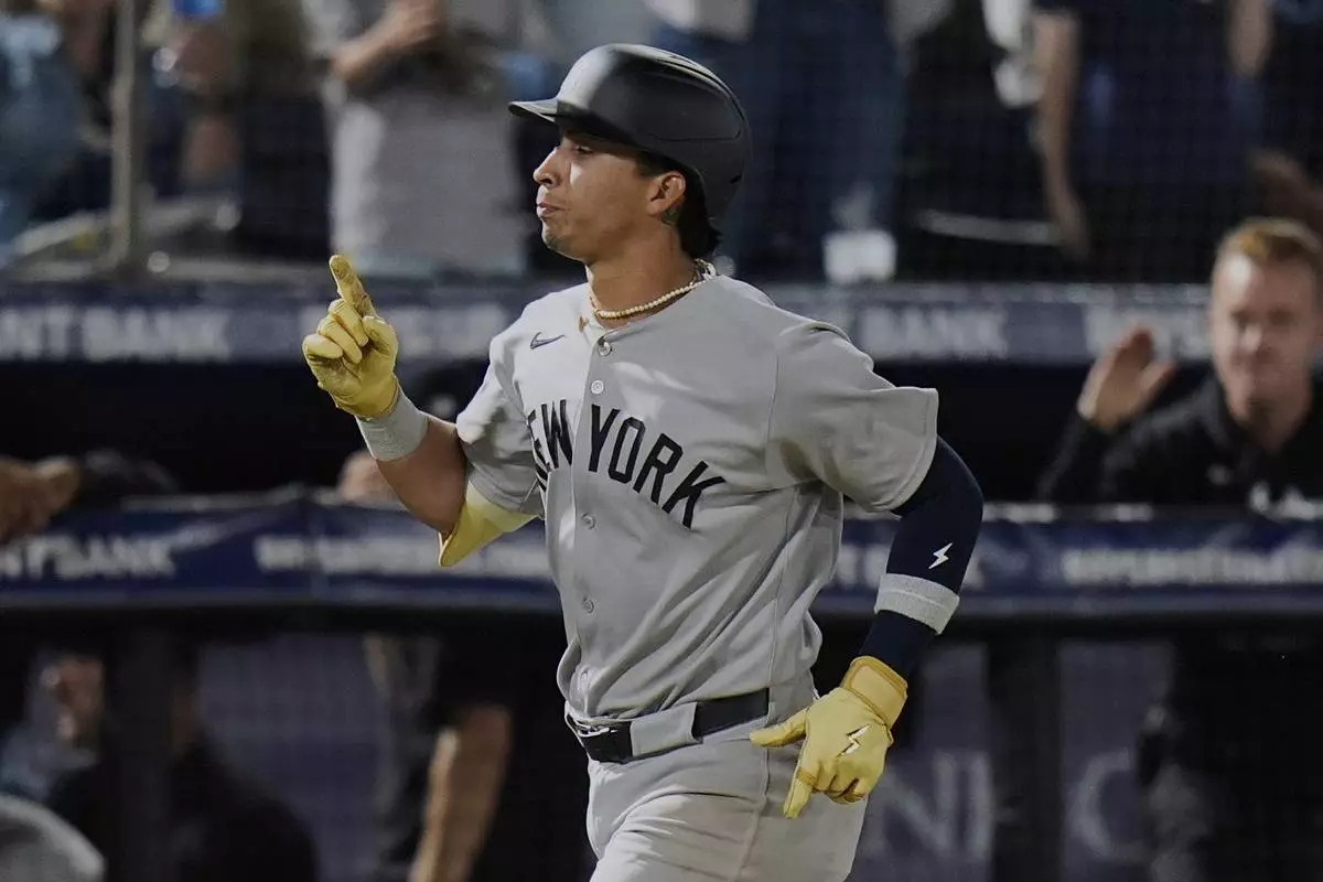 New York Yankees' Oswaldo Cabrera celebrates his solo home run off Tampa Bay Rays pitcher Taj Bradley during the fifth inning of a baseball game Thursday, April 17, 2025, in Tampa, Fla. (AP Photo/Chris O'Meara)