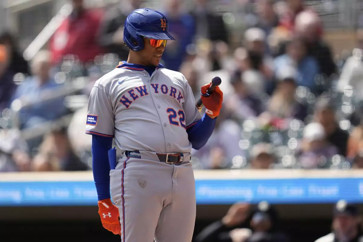 New York Mets' Juan Soto (22) reacts after striking out during the first inning of a baseball game against the Minnesota Twins, Wednesday, April 16, 2025, in Minneapolis. (AP Photo/Abbie Parr)