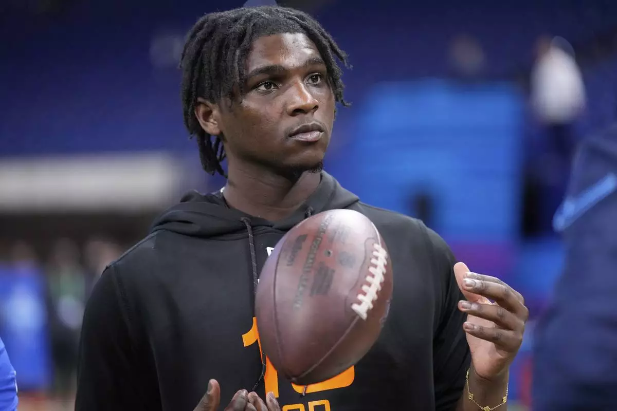 FILE - Miami quarterback Cam Ward watches a drill at the NFL football scouting combine in Indianapolis, Saturday, March 1, 2025. (AP Photo/George Walker IV,File)