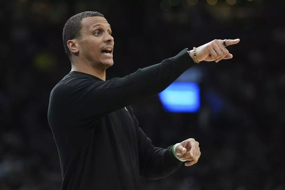 Boston Celtics head coach Joe Mazzulla calls to his players during the first half of an NBA basketball game against the Charlotte Hornets, Friday, April 11, 2025, in Boston. (AP Photo/Charles Krupa)