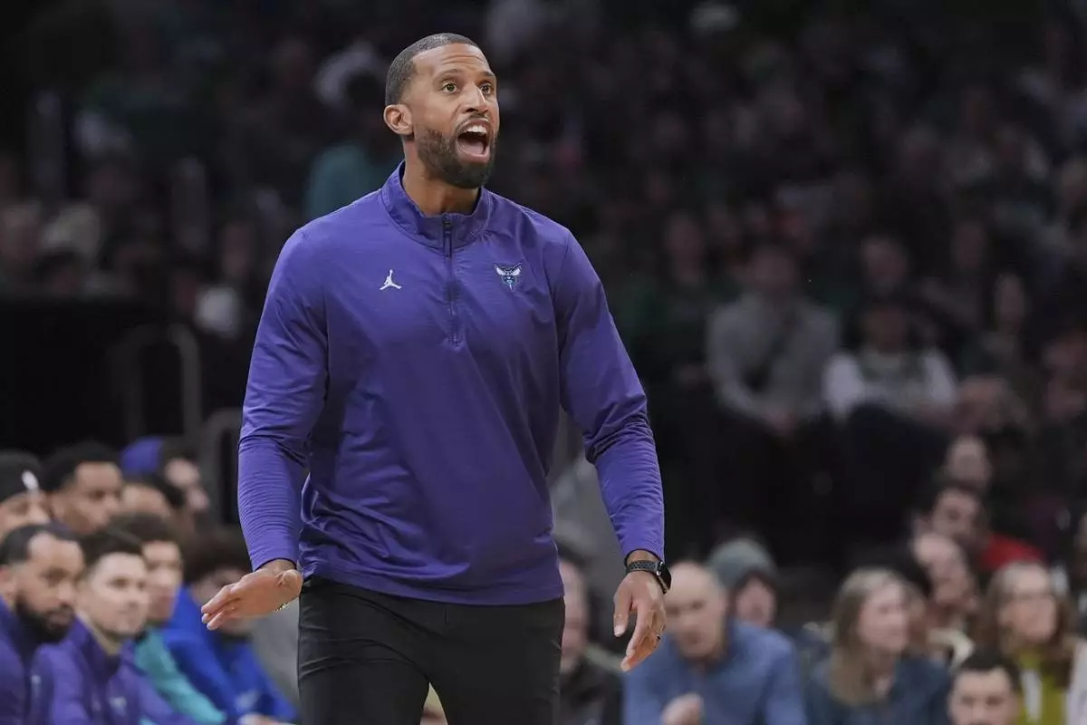 Charlotte Hornets head coach Charles Lee yells to his players during the first half of an NBA basketball game against Boston Celtics, Friday, April 11, 2025, in Boston. (AP Photo/Charles Krupa)