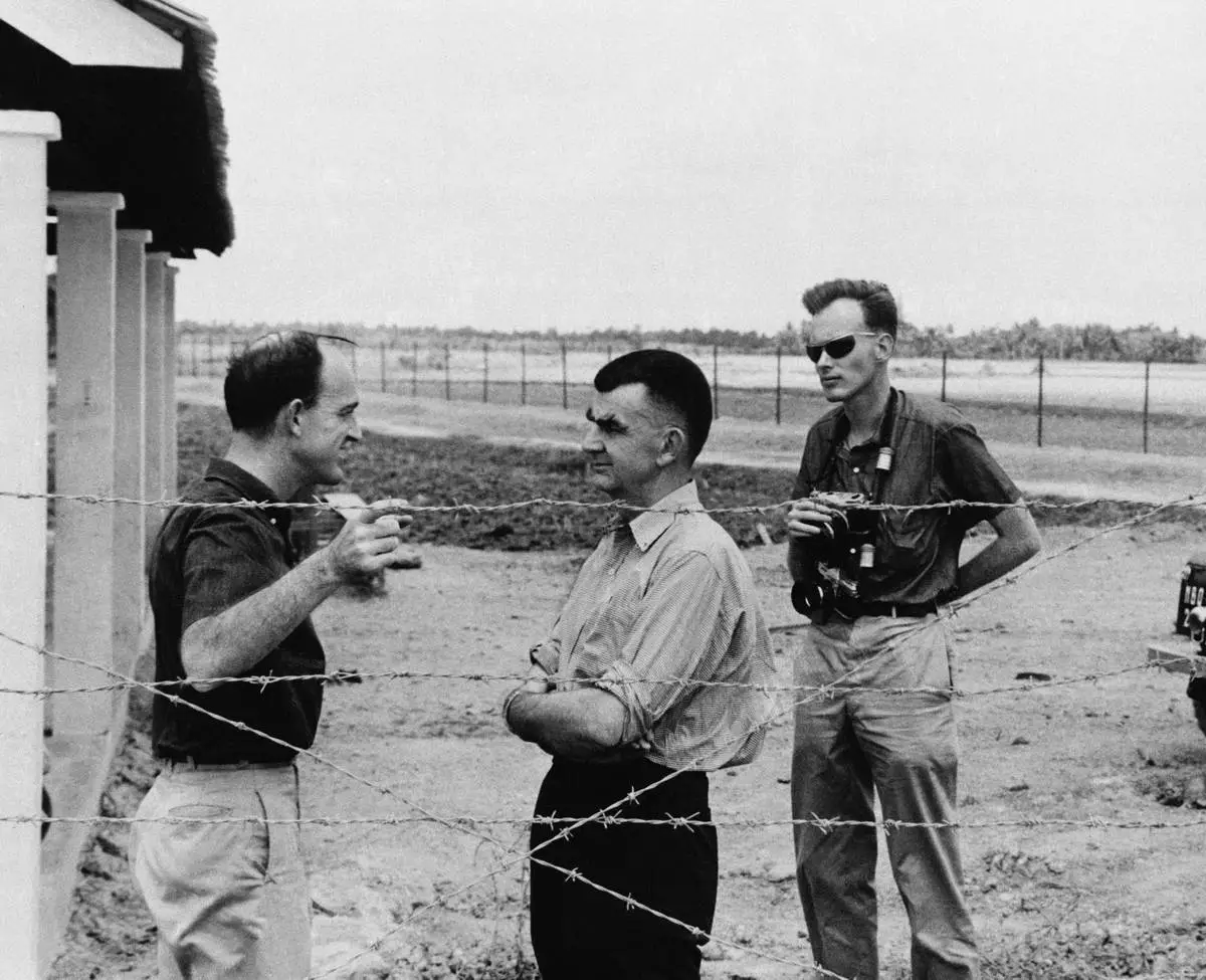 Wes Gallagher, center, general manager of the Associated Press, and Malcolm Browne, right, AP Saigon correspondent, speak with colleague Peter Arnett in Tan An, capital city of the Long An province in the Mekong Delta of Vietnam, March 23, 1964. (AP Photo)