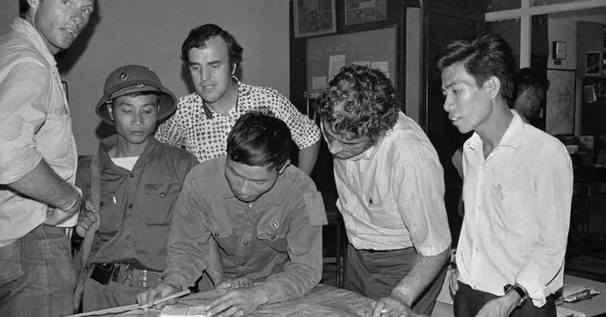 As communist troops streamed into Saigon, a few remaining reporters kept photos and stories flowing