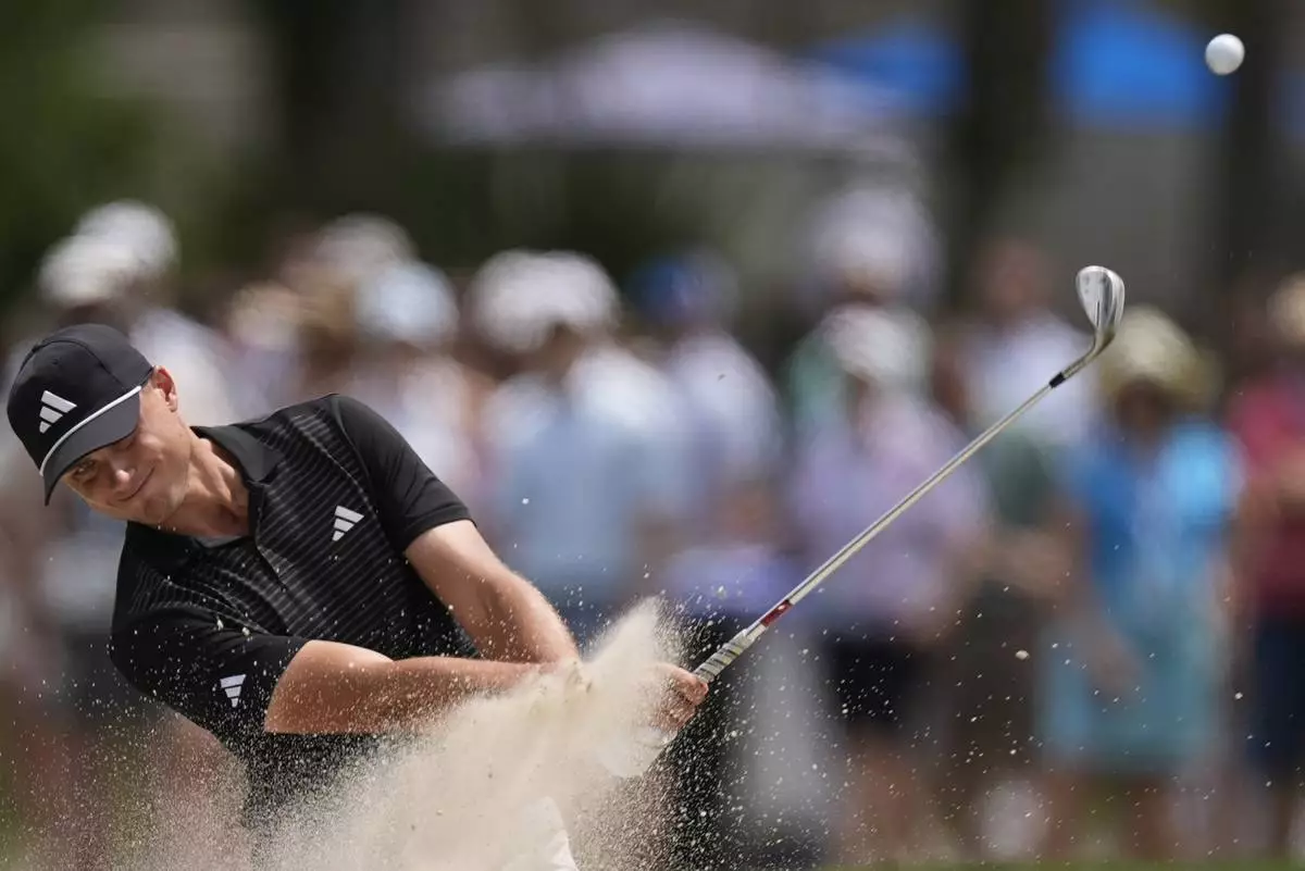 Ludvig Aberg, of Sweden, hits from a bunker on the 16th hole during the second round of the RBC Heritage golf tournament, Friday, April 18, 2025, in Hilton Head Island, S.C. (AP Photo/Mike Stewart)