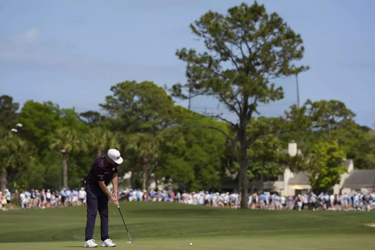 Taylor Pendrith, of Canada, putts on the 16th green during the second round of the RBC Heritage golf tournament, Friday, April 18, 2025, in Hilton Head Island, S.C. (AP Photo/Mike Stewart)