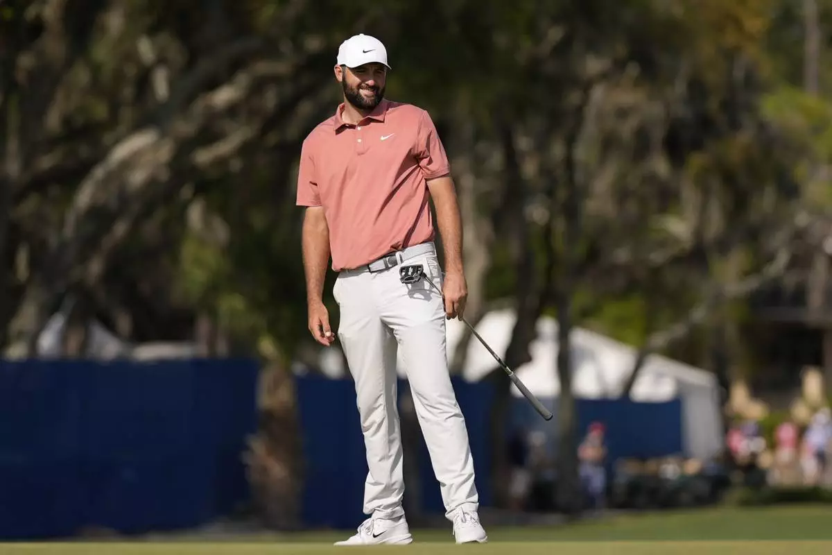 Scottie Scheffler reacts to his putt on the 17th green during the second round of the RBC Heritage golf tournament, Friday, April 18, 2025, in Hilton Head Island, S.C. (AP Photo/Mike Stewart)