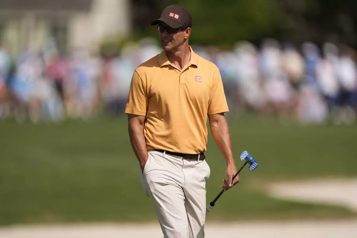 Adam Scott walks on the 16th green during the second round of the RBC Heritage golf tournament, Friday, April 18, 2025, in Hilton Head Island, S.C. (AP Photo/Mike Stewart)