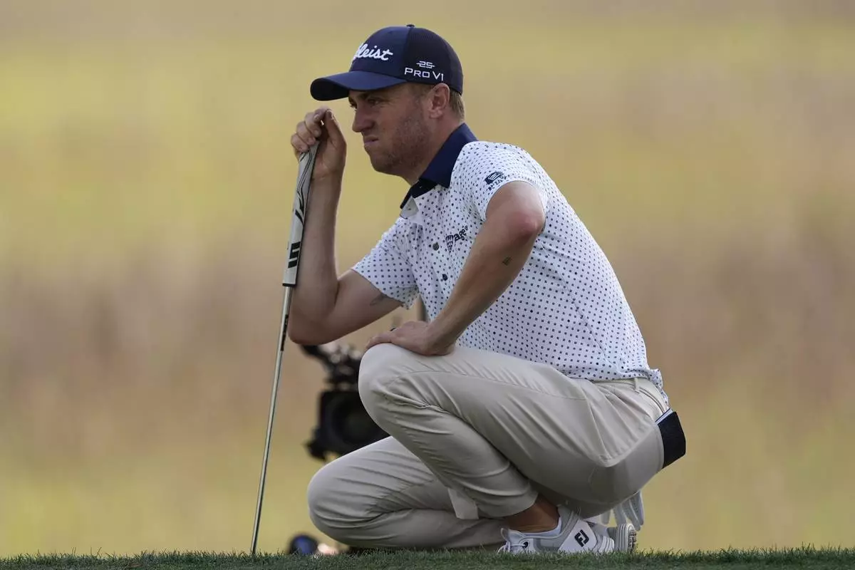 Justin Thomas lines up a putt on the 17th green during the second round of the RBC Heritage golf tournament, Friday, April 18, 2025, in Hilton Head Island, S.C. (AP Photo/Mike Stewart)