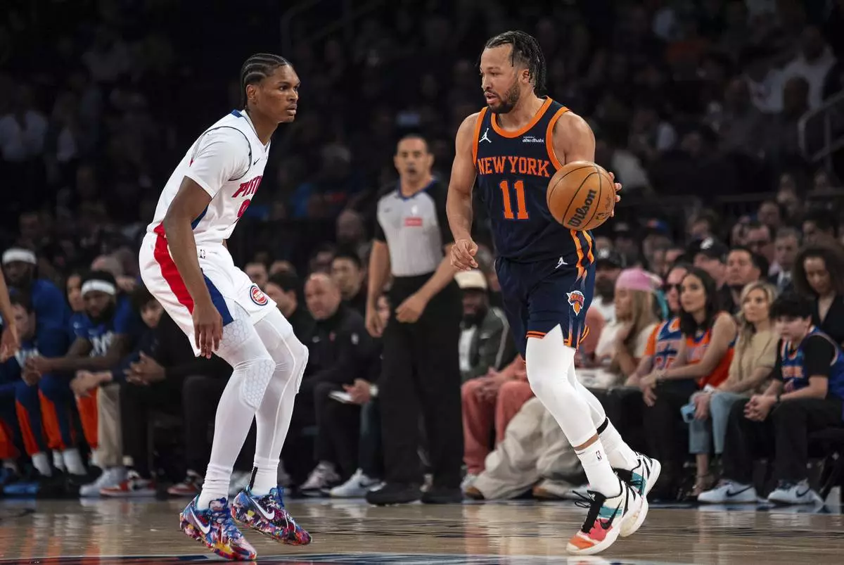 New York Knicks guard Jalen Brunson (11) looks for an opening against the Detroit Pistons during the first half of Game 2 of an NBA basketball first-round playoff series, Monday, April 21, 2025, in New York. (AP Photo/Angelina Katsanis)