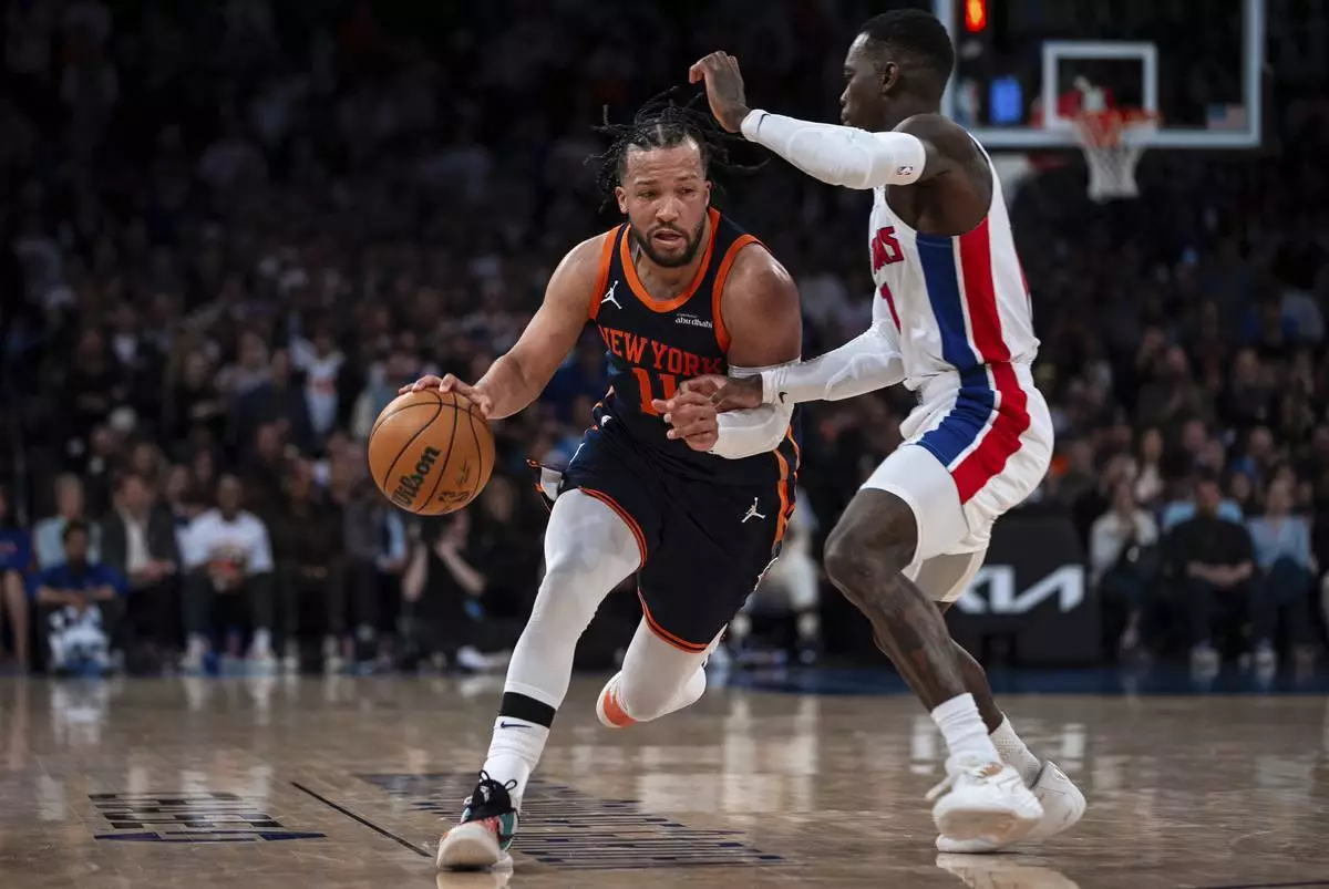 New York Knicks guard Jalen Brunson (11) drives toward the basket to make a 2-pointer at the end of Game 2 of an NBA basketball first-round playoff series against the Detroit Pistons, Monday, April 21, 2025, in New York. (AP Photo/Angelina Katsanis)