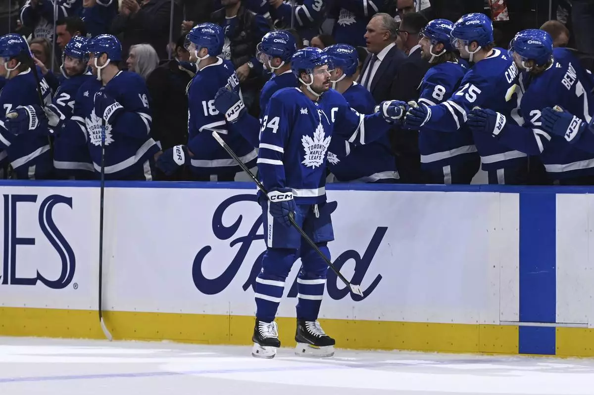 Toronto Maple Leafs' Auston Matthews (34) celebrates his goal against the Detroit Red Wings during the first period of their NHL hockey game Thursday, April 17, 2025 in Toronto. (Jon Blacker/The Canadian Press via AP)