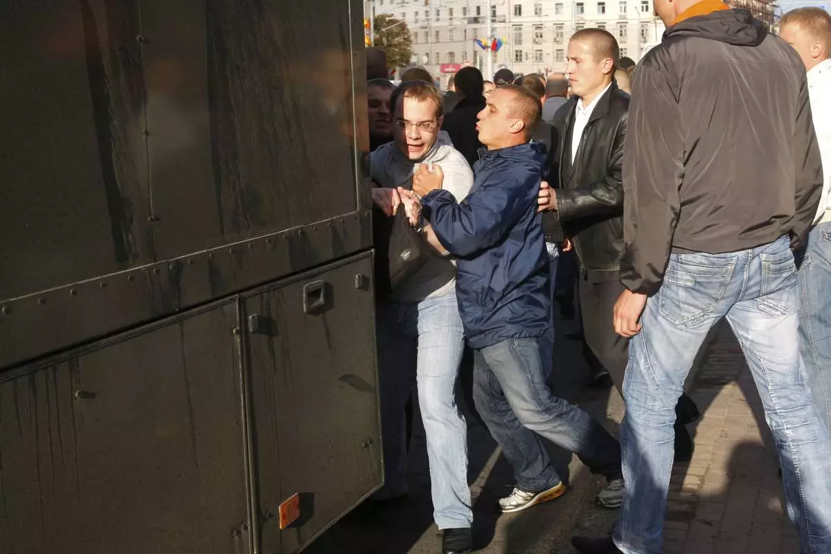 FILE - Belarus plainclothes policemen detain political analyst Ihar Iliyash during a rally in Minsk, Belarus, on July 3, 2011. (AP Photo, File)