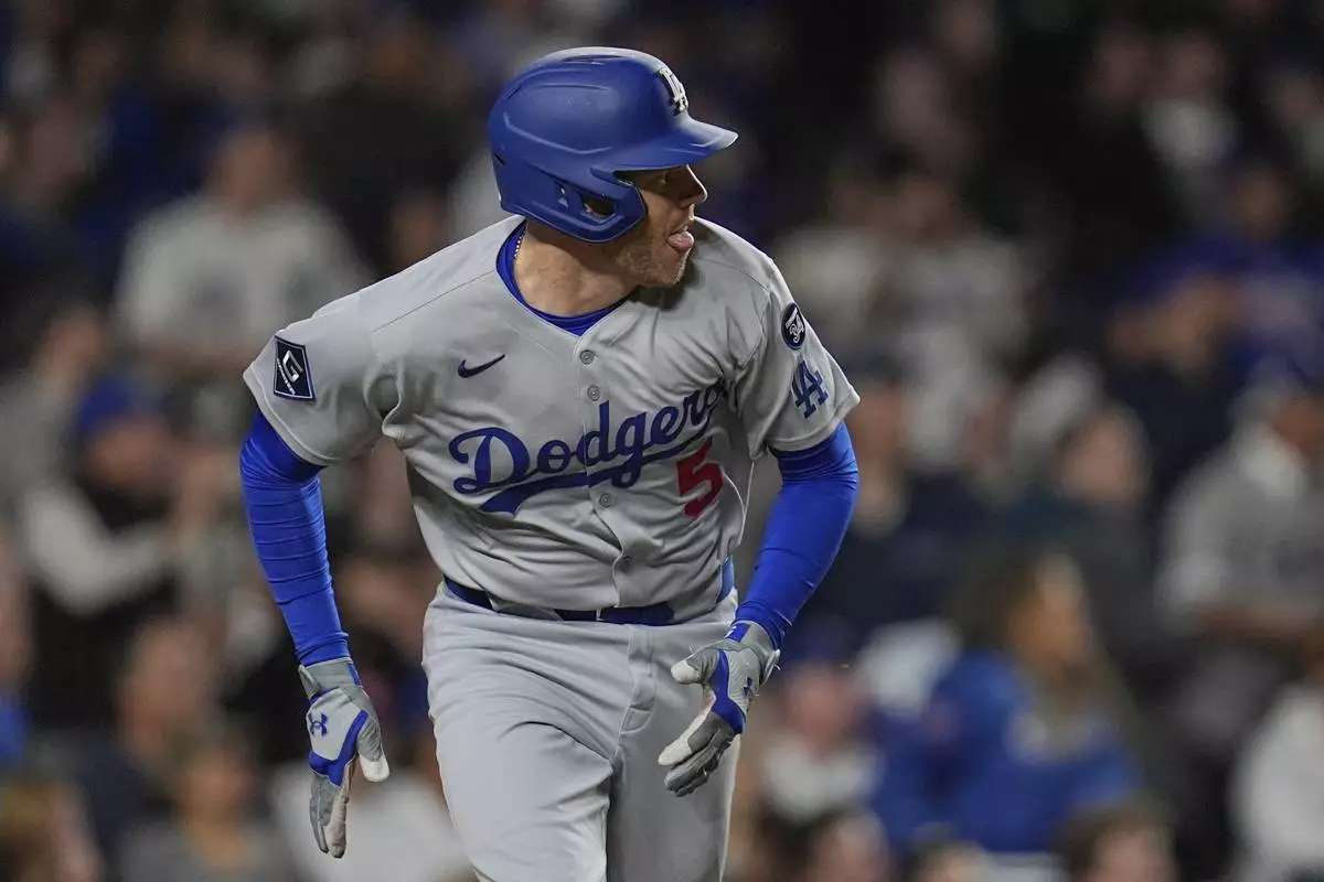 Los Angeles Dodgers' Freddie Freeman (5) runs the bases on a double during the seventh inning of a baseball game against the Chicago Cubs, Tuesday, April 22, 2025, in Chicago. (AP Photo/Erin Hooley)