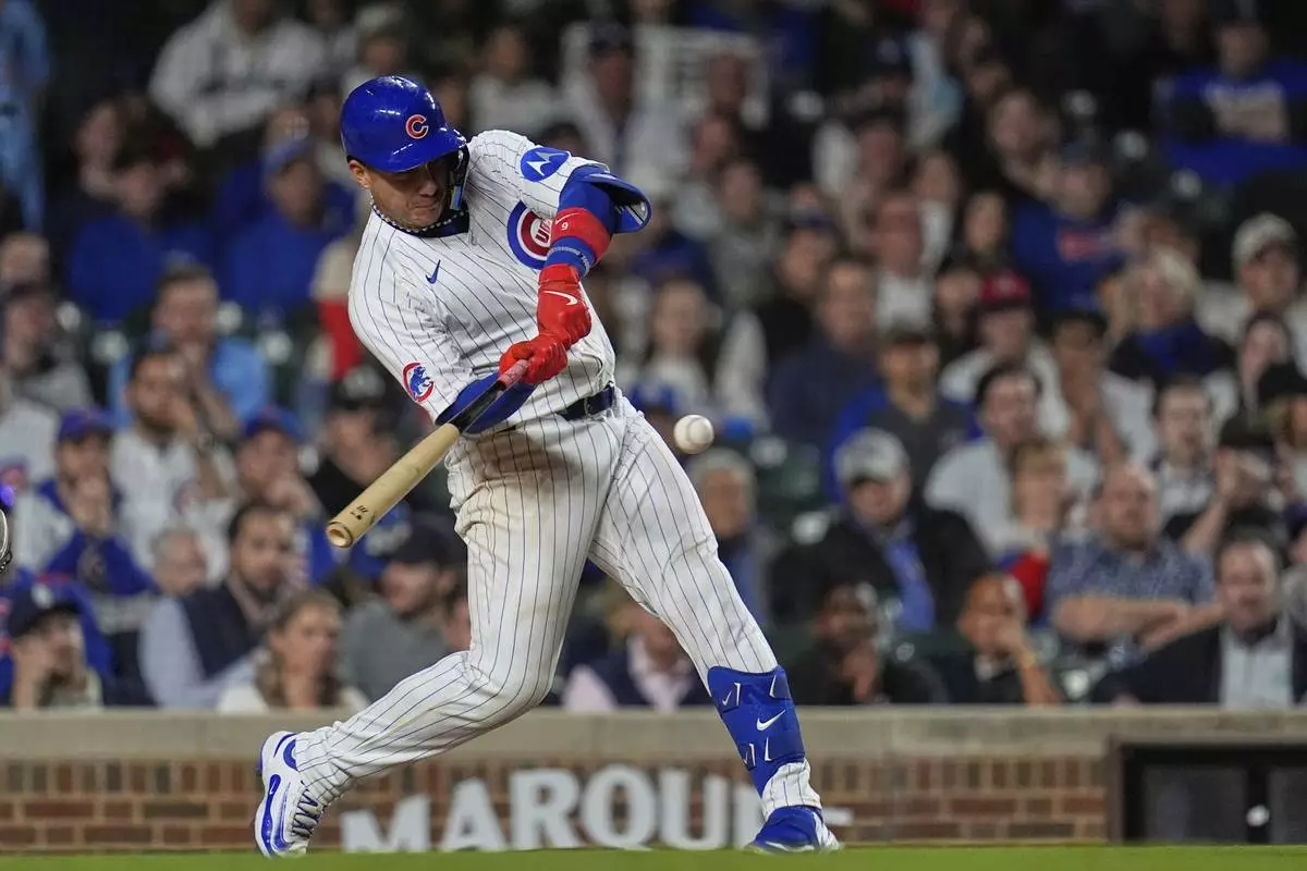 Chicago Cubs' Miguel Amaya (9) hits a game-tying home run during the ninth inning of a baseball game against the Los Angeles Dodgers, Tuesday, April 22, 2025, in Chicago. (AP Photo/Erin Hooley)