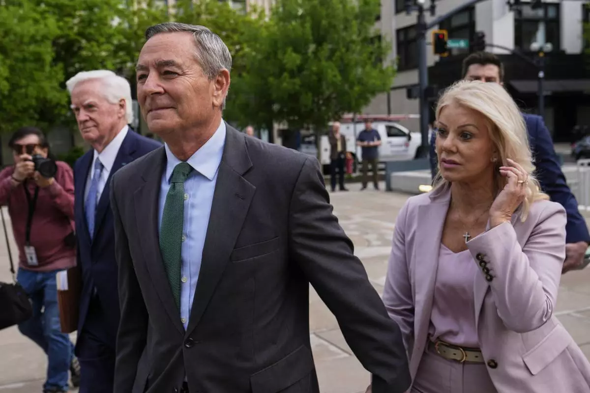 Former Tennessee House Speaker Glen Casada, center, arrives at the federal courthouse Tuesday, April 22, 2025, in Nashville, Tenn. (AP Photo/George Walker IV)