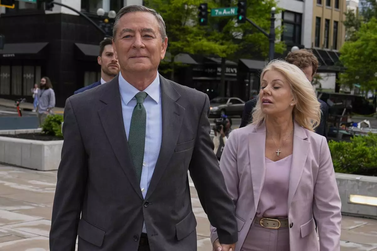 Former Tennessee House Speaker Glen Casada, center, arrives at the federal courthouse Tuesday, April 22, 2025, in Nashville, Tenn. (AP Photo/George Walker IV)