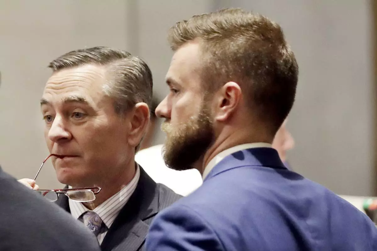 FILE - In this May 2, 2019, file photo, House Speaker Glen Casada, R-Franklin, left, talks with Cade Cothren, right, his chief of staff, during a House session in Nashville, Tenn. (AP Photo/Mark Humphrey, File)