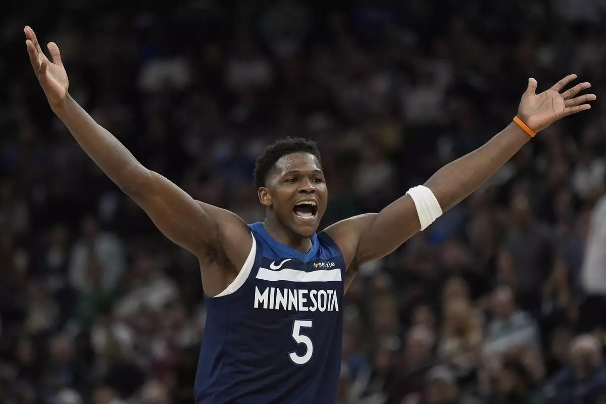 Minnesota Timberwolves guard Anthony Edwards (5) reacts during the second half of an NBA basketball game against the Utah Jazz, Sunday, April 13, 2025, in Minneapolis. (AP Photo/Abbie Parr)
