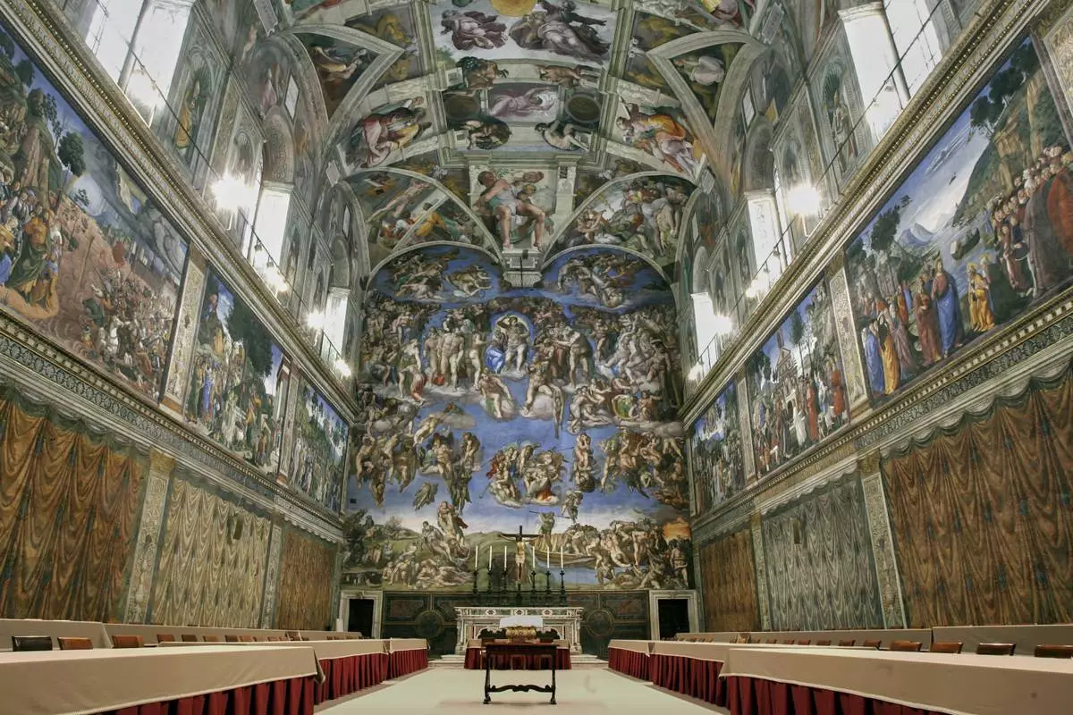 FILE - Tables and chairs line the Sistine Chapel at the Vatican in preparation for the conclave, on April 16, 2005. (AP Photo/Pier Paolo Cito, File)