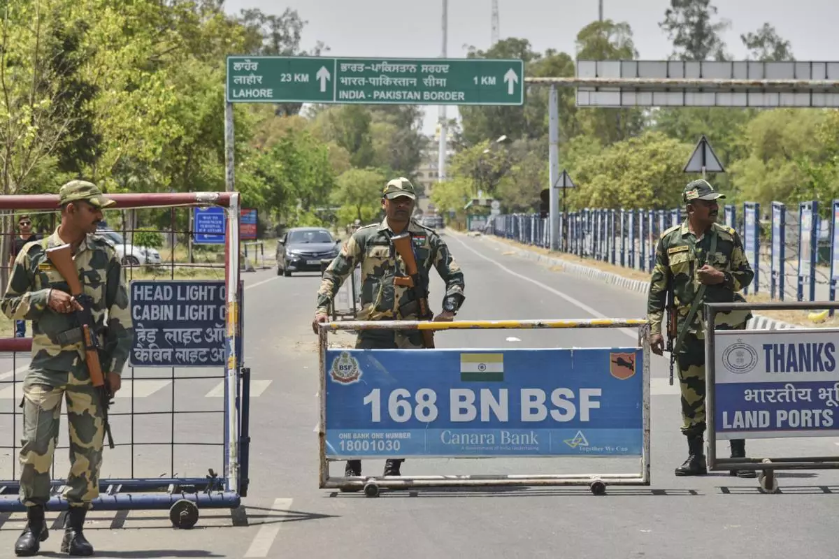 Indian Border Security Force soldiers stand guard at the barricade on the road leading to the Attari-Wagah border on India's side, near Amritsar, Thursday, April 24, 2025. (AP Photo/Prabhjot Gill)