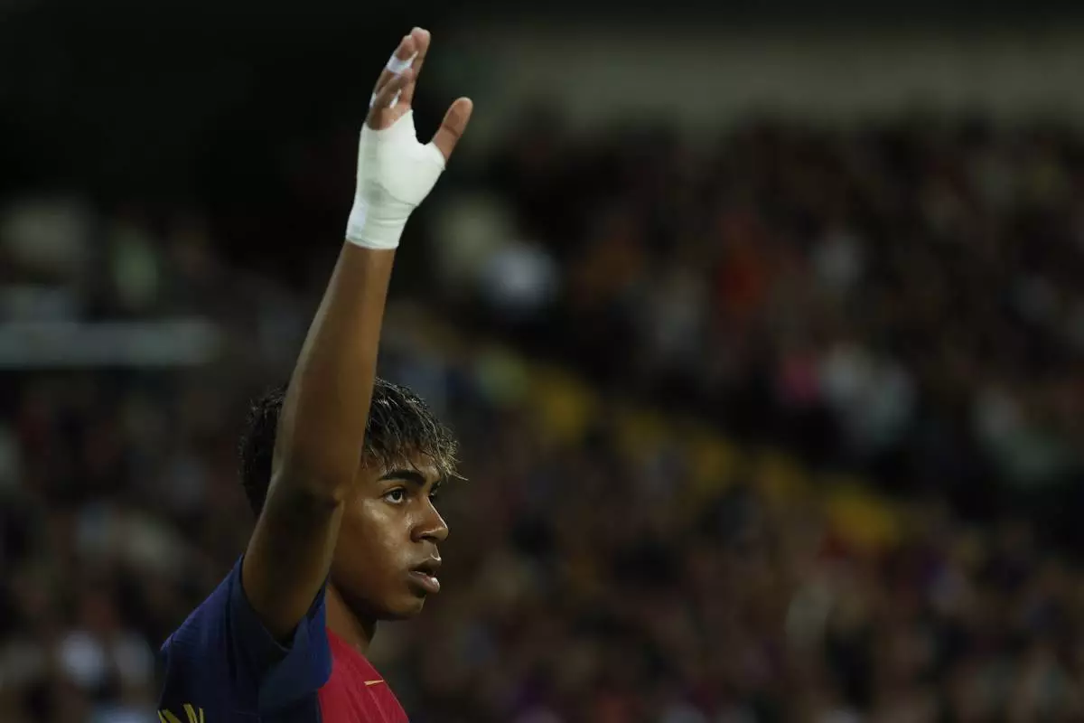 Barcelona's Lamine Yamal gets ready to take a corner kick during a Spanish La Liga soccer match between Barcelona and Mallorca at the Lluis Companys Olympic stadium in Barcelona, Spain, Tuesday, April 22, 2025. (AP Photo/Joan Monfort)