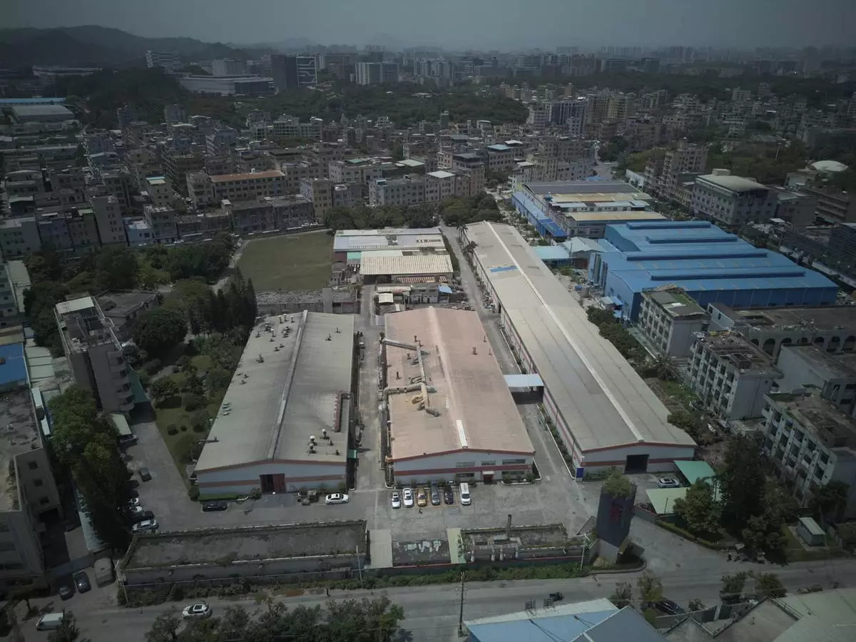 An aerial view of a factory of Kam Pin Industrial (HK) Ltd, manufacturer of coated aluminum panels, in Dongguan city in southern China's Guangdong province on Thursday, April 17, 2025. (AP Photo/Ng Han Guan)