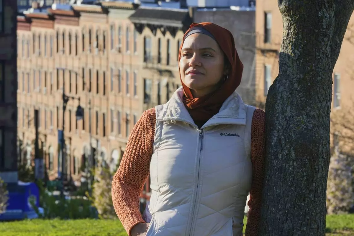 Daniris Espinal stands for a portrait in Sunset Park, in the Brooklyn borough of New York, Thursday, April 17, 2025. (AP Photo/Richard Drew)