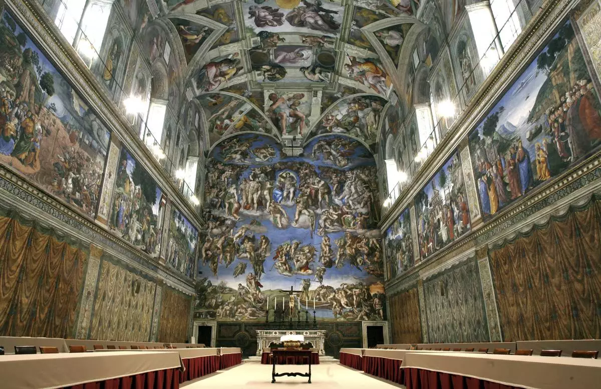 FILE - Tables and chairs line the Sistine Chapel at the Vatican in preparation for the conclave, on April 16, 2005. (AP Photo/Pier Paolo Cito, File)
