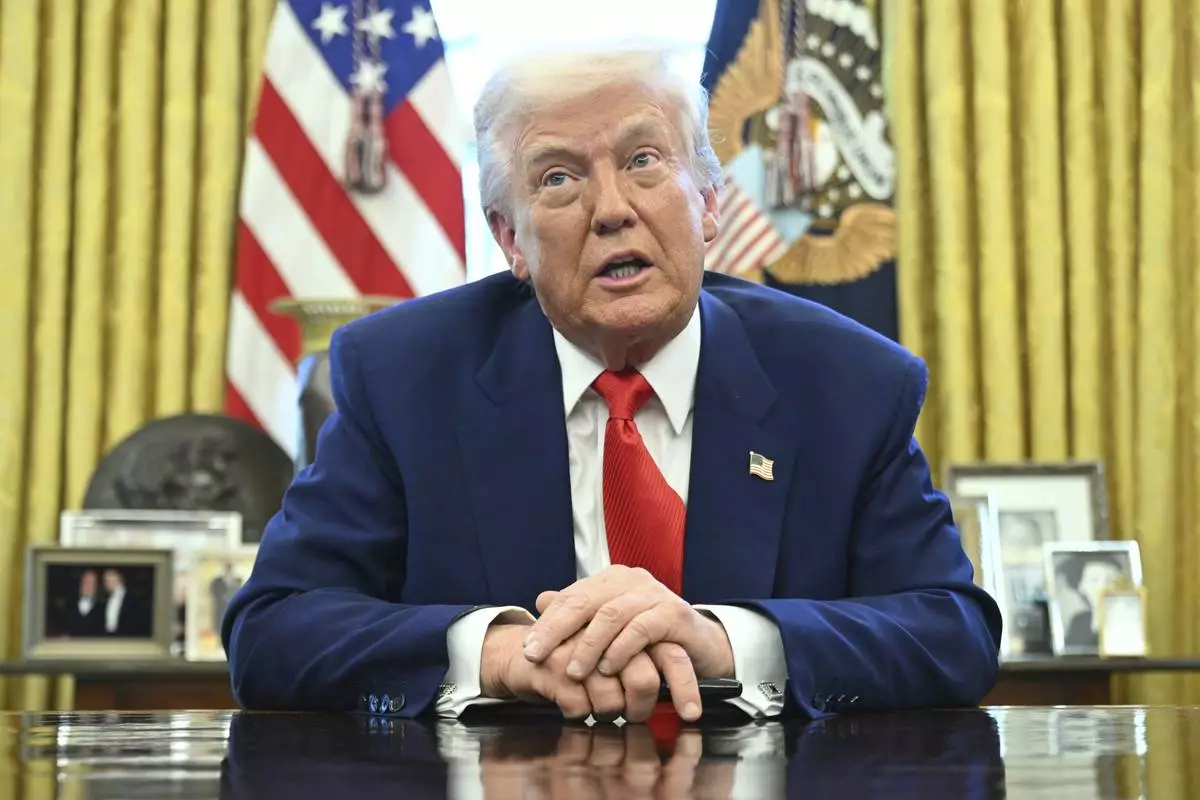 President Donald Trump speaks after signing an executive order in the Oval Office of the White House Wednesday, April 9, 2025, in Washington. (Pool via AP)
