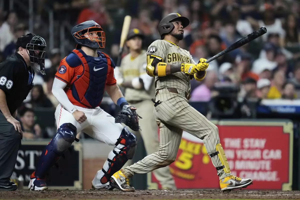 San Diego Padres' Luis Arraez watches his home run hit during the seventh inning of a baseball game against the Houston Astros in Houston, Friday, April 18, 2025. (AP Photo/Ashley Landis)