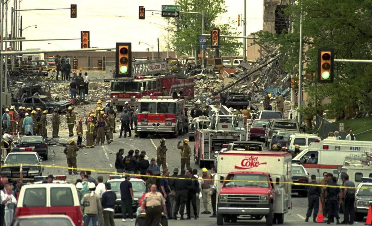 FILE - The streets surrounding the Alfred P. Murrah Federal Building in Oklahoma City are swamped with emergency vehicles and personnel on April 20, 1995, after a bomb tore through the building. (AP Photo/David J. Phillip, File)