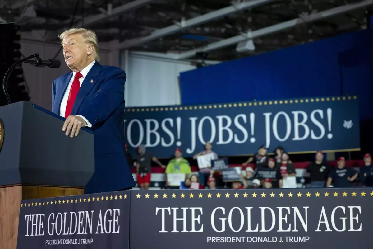 President Donald Trump speaks on his first 100 days at Macomb County Community College Sports Expo Center, Tuesday, April 29, 2025, in Warren, Mich. (AP Photo/Alex Brandon)