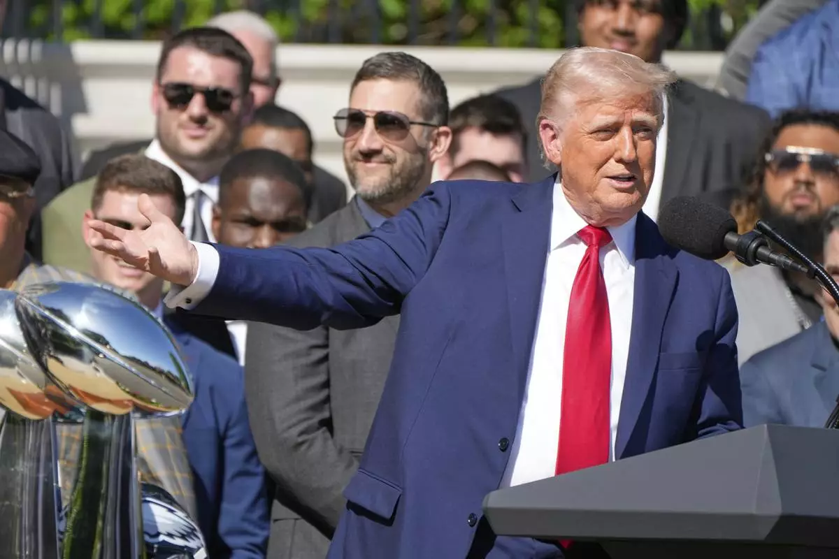 President Donald Trump speaks as he welcomes the Super Bowl champion Philadelphia Eagles NFL football team to the South Lawn of the White House, Monday, April 28, 2025, in Washington. (AP Photo/Mark Schiefelbein)