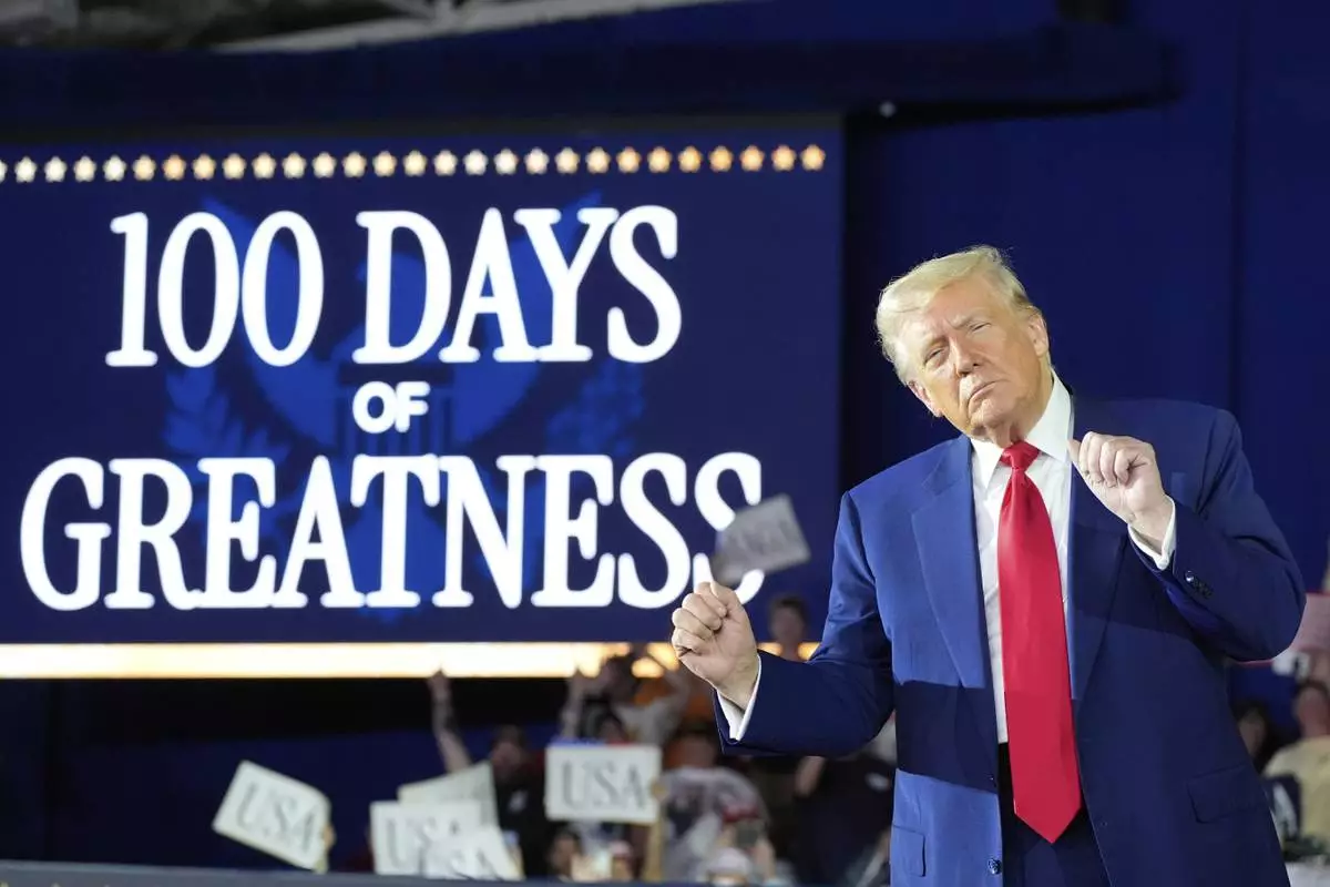 President Donald Trump arrives to speak on his first 100 days at Macomb County Community College Sports Expo Center, Tuesday, April 29, 2025, in Warren, Mich. (AP Photo/Alex Brandon)