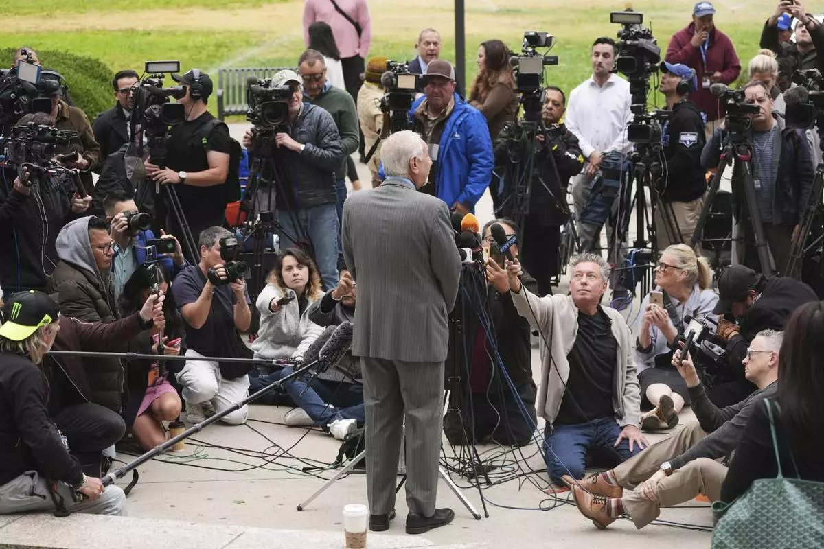Attorney Mark Geragos, representing Erik and Lyle Menendez, speaks to the media as he arrives for a hearing in their case Thursday, April 17, 2025, in Los Angeles. (AP Photo/Damian Dovarganes)