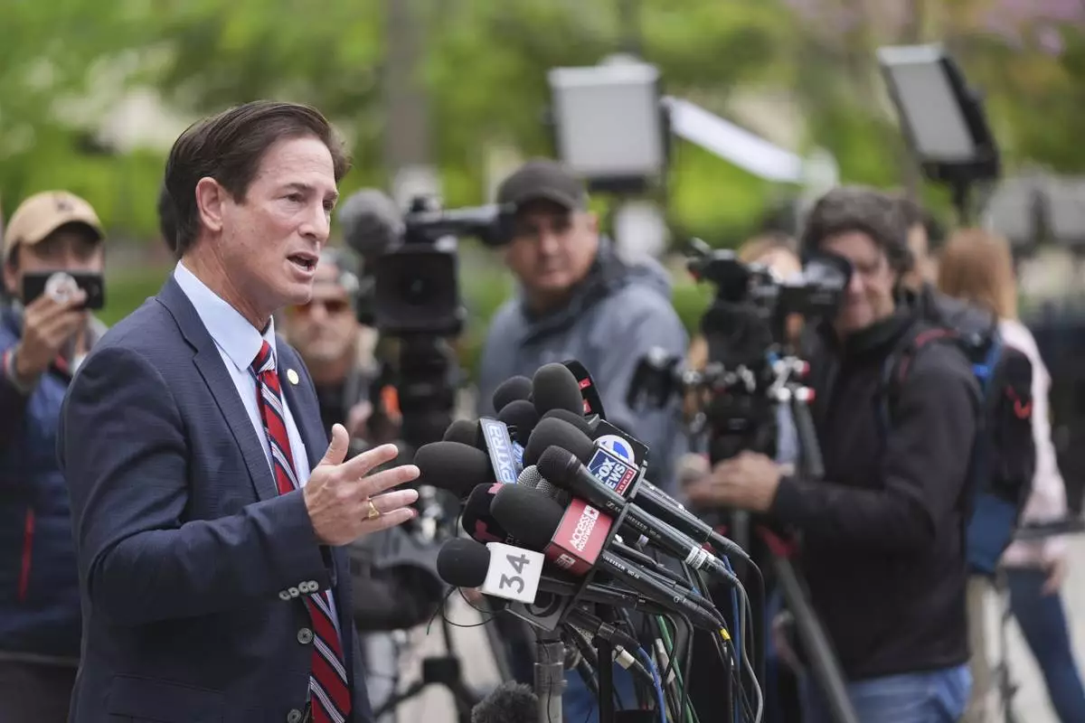 Los Angeles County District Attorney Nathan Hochman speaks outside of court before a hearing in the case of Erik and Lyle Menendez Thursday, April 17, 2025, in Los Angeles. (AP Photo/Damian Dovarganes)