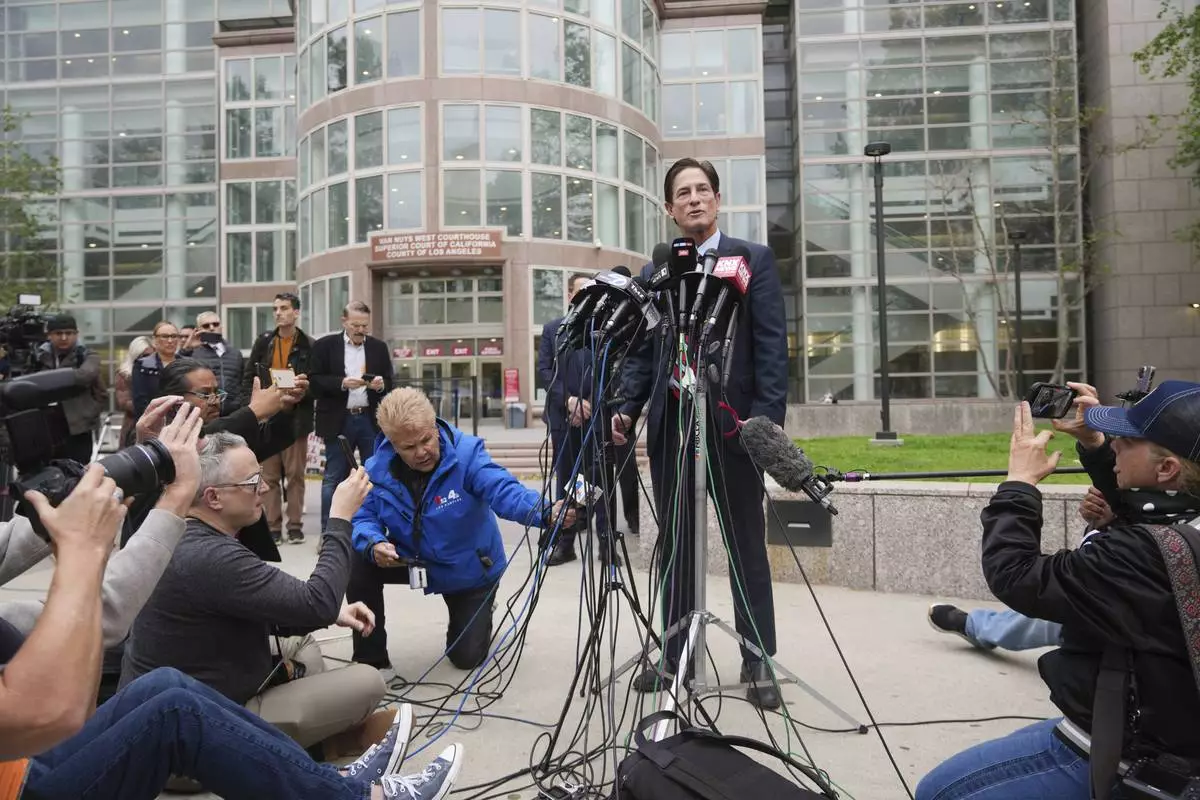 Los Angeles County District Attorney Nathan Hochman speaks outside of court before a hearing in the case of Erik and Lyle Menendez Thursday, April 17, 2025, in Los Angeles. (AP Photo/Damian Dovarganes)