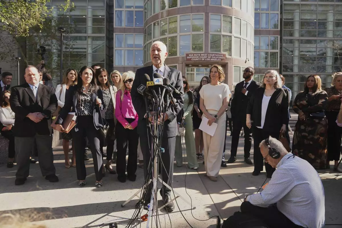 Attorney Mark Geragos speaks after a hearing regarding the case of Erik and Lyle Menendez Friday, April 11, 2025, in Los Angeles. (AP Photo/Damian Dovarganes)