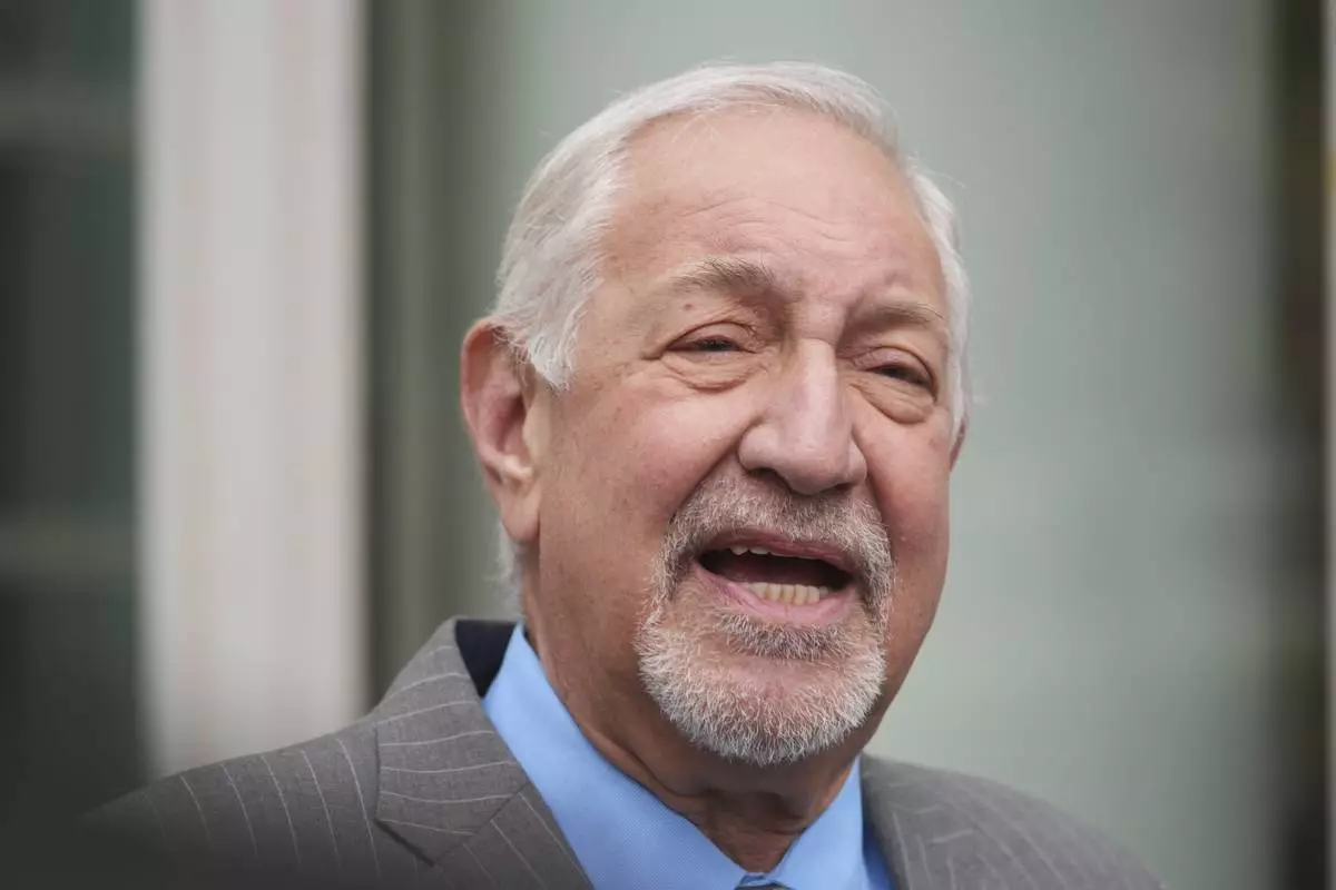 Attorney Mark Geragos, representing Erik and Lyle Menendez, speaks to the media as he arrives for a hearing in their case Thursday, April 17, 2025, in Los Angeles. (AP Photo/Damian Dovarganes)
