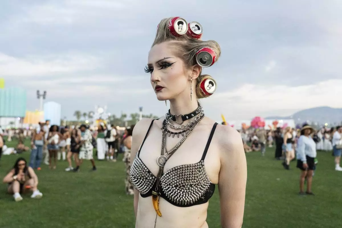 Festivalgoer Lily Bown, of Indio, poses during the first weekend of the Coachella Valley Music and Arts Festival at the Empire Polo Club on Friday, April 11, 2025, in Indio, Calif. (Photo by Amy Harris/Invision/AP)