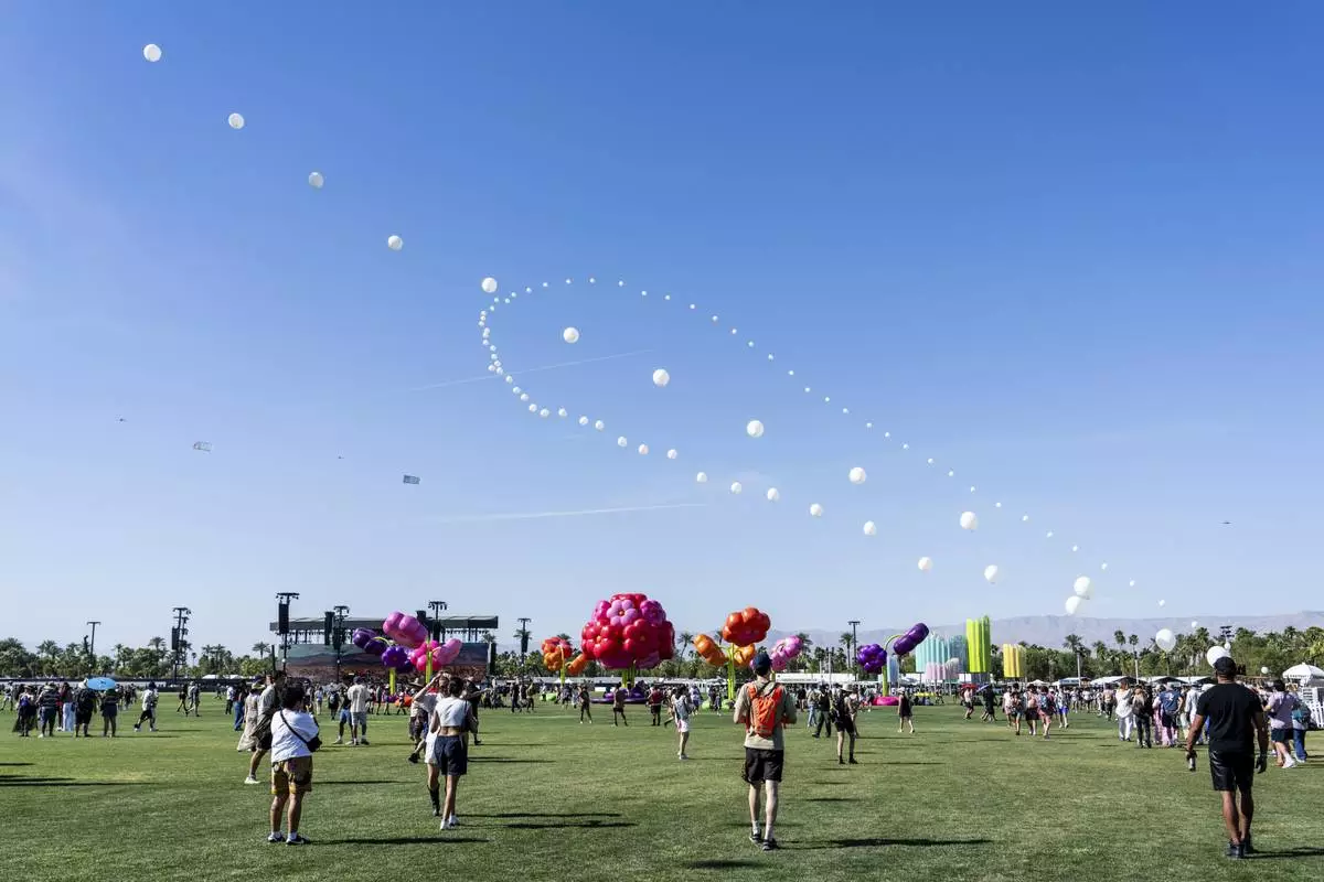 Festivalgoers are seen during the first weekend of the Coachella Valley Music and Arts Festival at the Empire Polo Club on Friday, April 11, 2025, in Indio, Calif. (Photo by Amy Harris/Invision/AP)