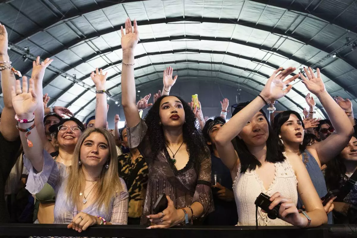 Festivalgoers are seen during the first weekend of the Coachella Valley Music and Arts Festival at the Empire Polo Club on Friday, April 11, 2025, in Indio, Calif. (Photo by Amy Harris/Invision/AP)