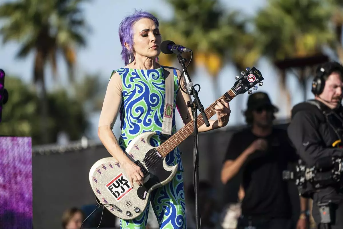 EDS NOTE: OBSCENITY - Jane Wiedlin of The Go-Go's performs during the first weekend of the Coachella Valley Music and Arts Festival at the Empire Polo Club on Friday, April 11, 2025, in Indio, Calif. (Photo by Amy Harris/Invision/AP)
