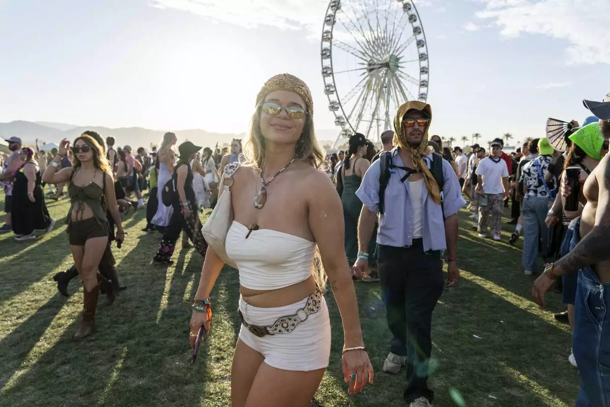 Festivalgoers are seen during the first weekend of the Coachella Valley Music and Arts Festival at the Empire Polo Club on Saturday, April 12, 2025, in Indio, Calif. (Photo by Amy Harris/Invision/AP)