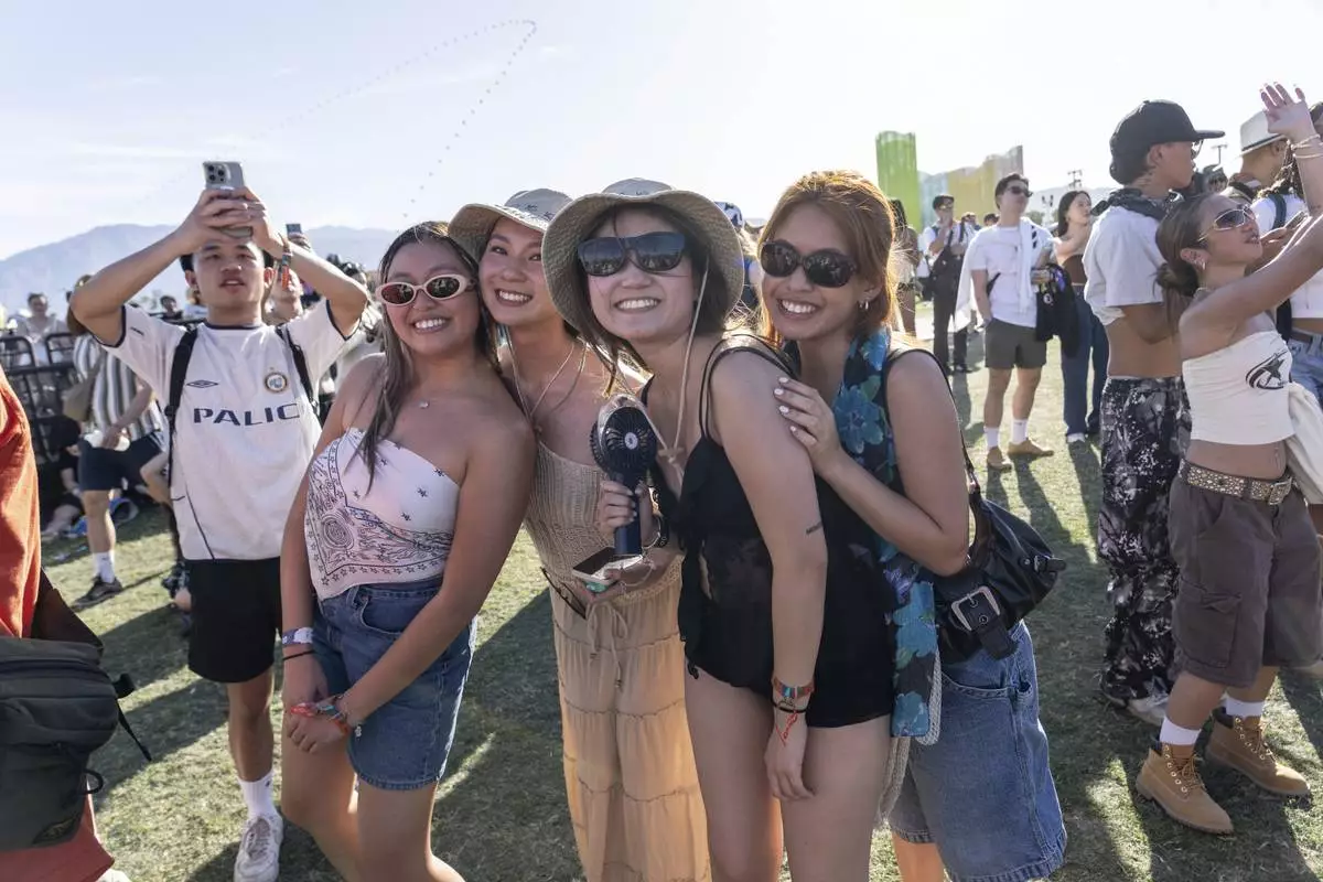 Festivalgoers are seen during the first weekend of the Coachella Valley Music and Arts Festival at the Empire Polo Club on Sunday, April 13, 2025, in Indio, Calif. (Photo by Amy Harris/Invision/AP)