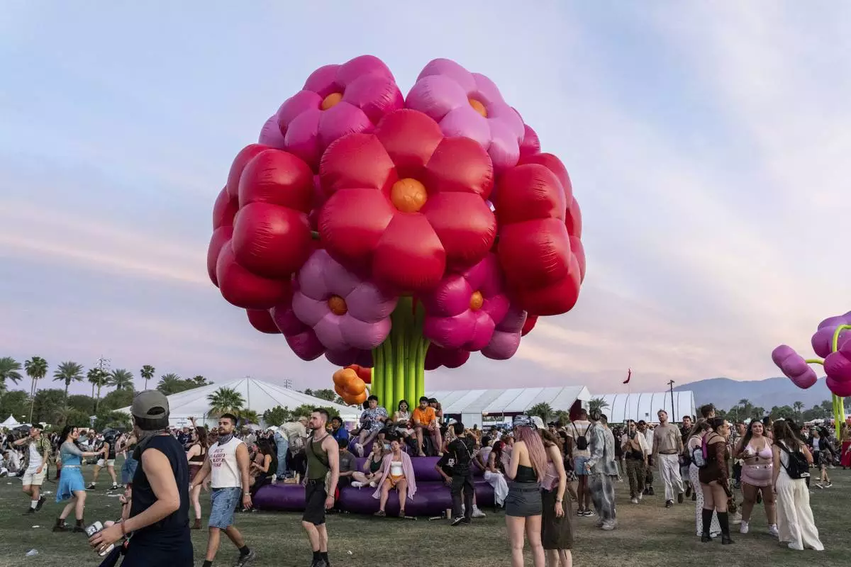 Festivalgoers are seen during the first weekend of the Coachella Valley Music and Arts Festival at the Empire Polo Club on Sunday, April 13, 2025, in Indio, Calif. (Photo by Amy Harris/Invision/AP)